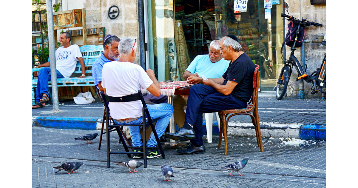 Four men hard at play in Haifa. Sometimes work must wait.