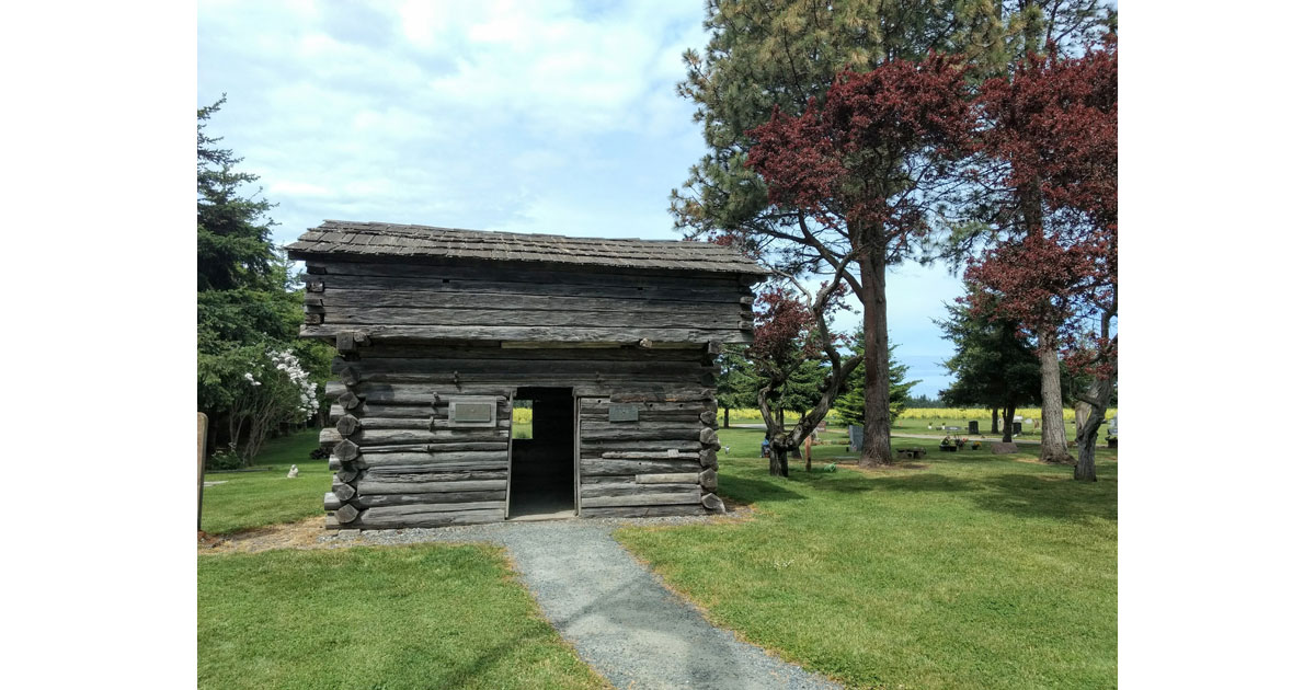 A restored 1850s Blockhouse at Sunnyside Cemetery in Ebey's Landing