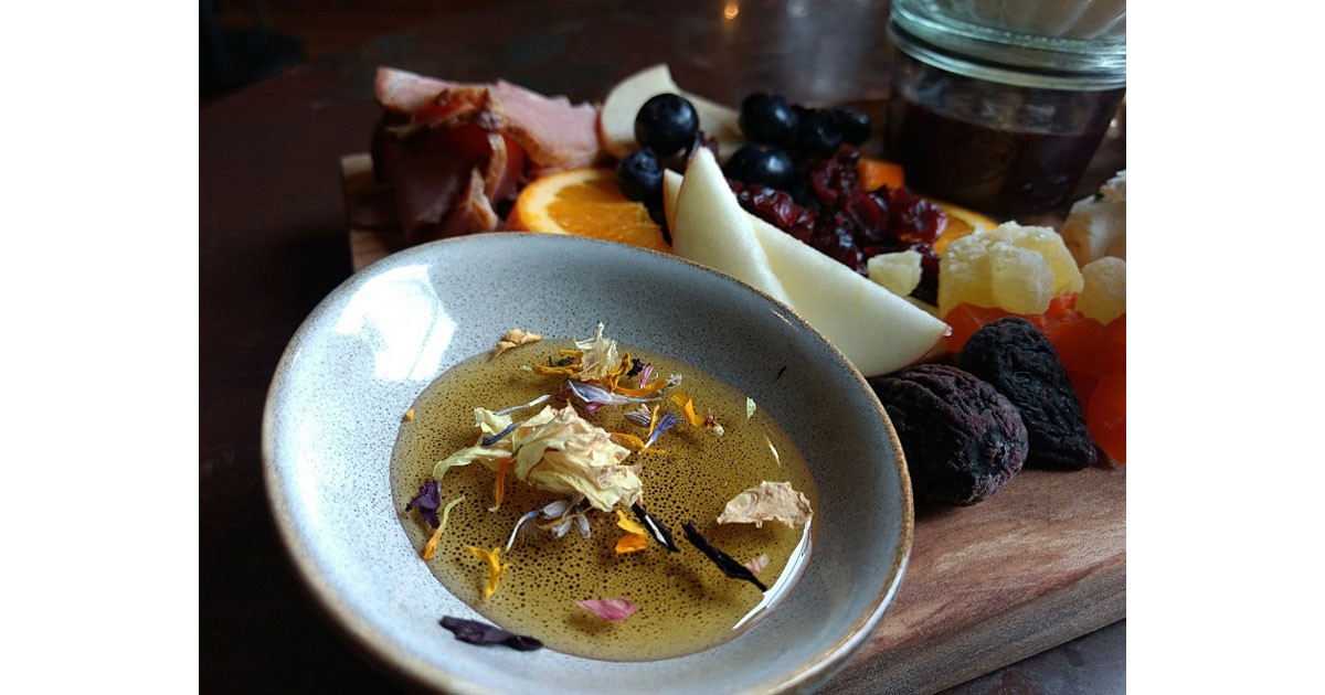 Local honey, fruit, cured ham, preserves and more on the Captain Whidbey Breakfast Board